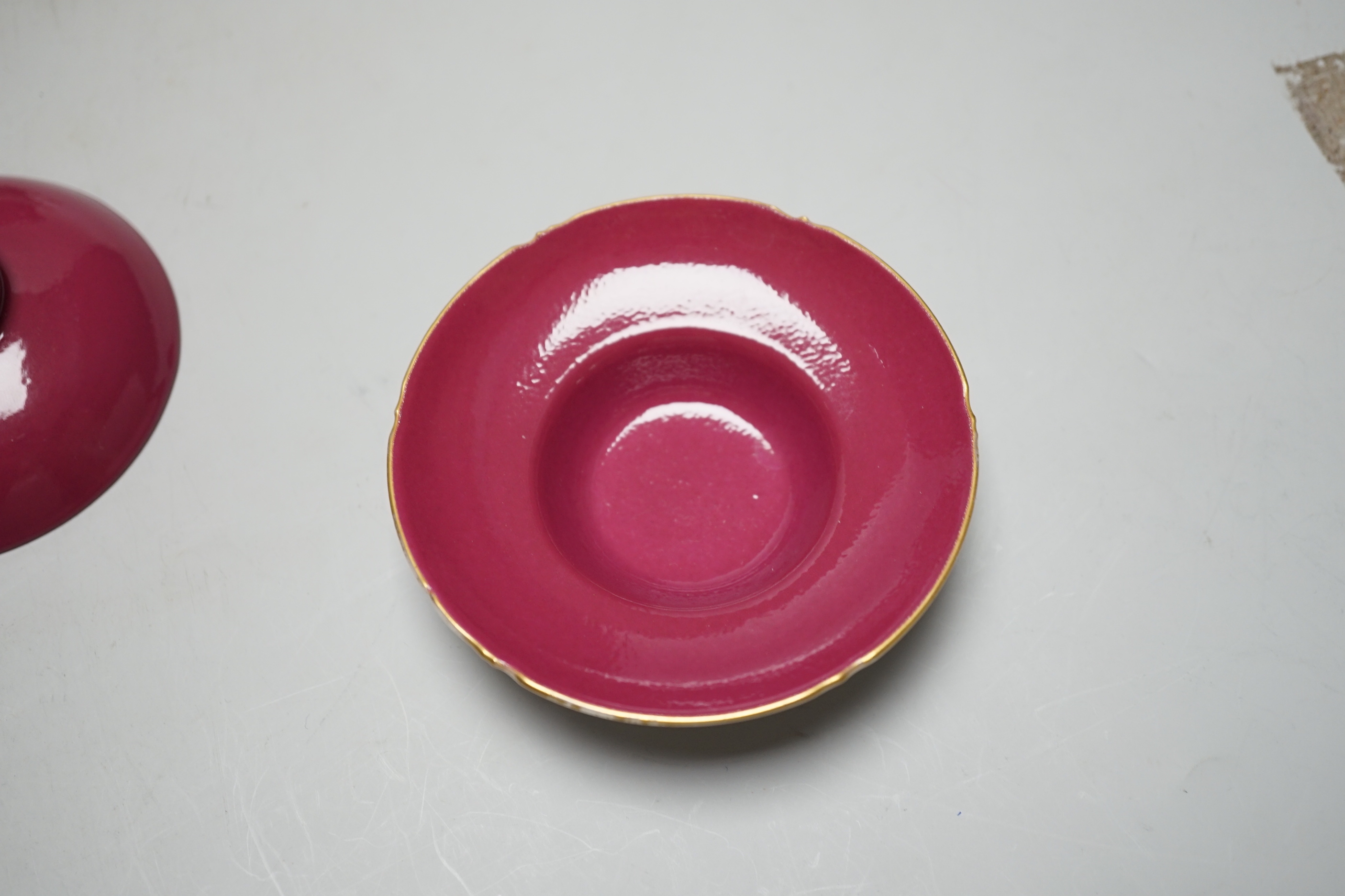 A pair of Chinese ruby ground tea bowls, covers and stands